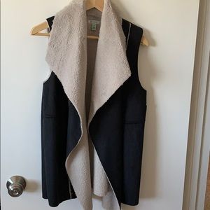 Black suede vest with white faux fur underneath